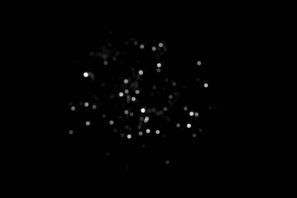 istock White gray blurred bokeh lights on black background 1421052380