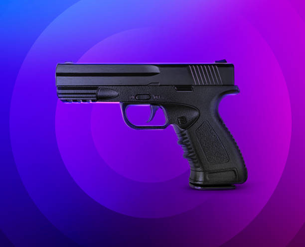 istock pistol on background circles purple blue pink 1421052632
