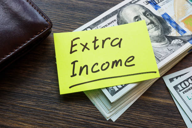 istock Stack of money and inscription Extra income. 1421052871