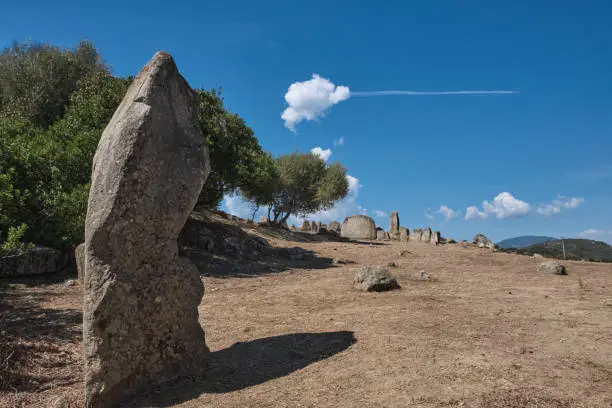 Photo of giants' tomb, (neolithic funerary graves), and standing stones. - sardinia - italy.