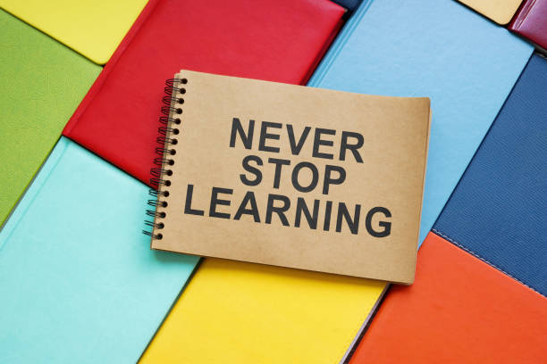 istock Never stop learning sign on the colorful books. 1421053102