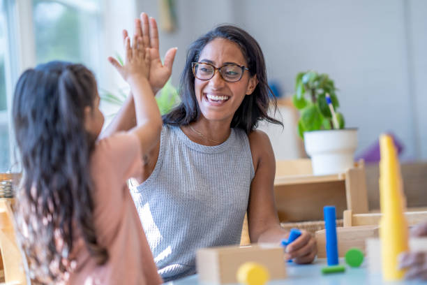 istock High Five in a Montessori Classroom 1421053104
