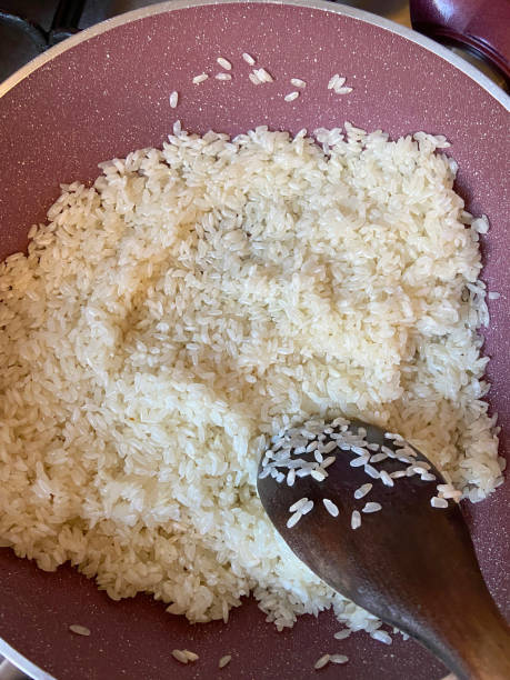istock Cooking rice, rice in the cooking pan 1421055198