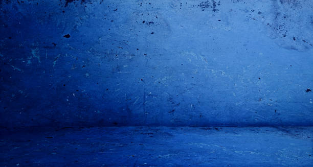 istock grungy blue rustic concrete wall and floor use as backdrop for product displayed for advertisement. old stained room, background, studio, interior, space. 1421057838