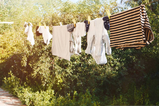 istock Freshly washed laundry is dried outside in sunny weather 1421057889
