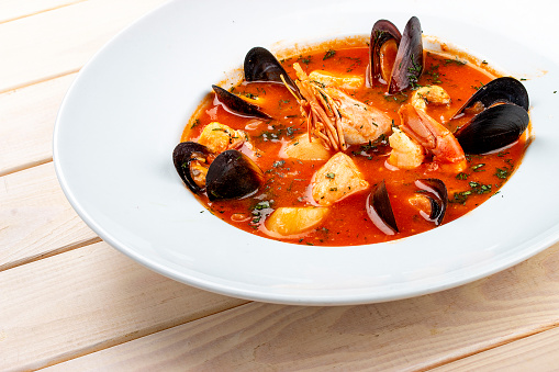 Spanish soup bouillabaisse with seafood, mussels, shrimps and scallop.
