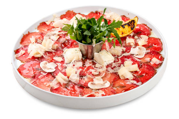 Veal carpaccio with parmesan cheese and mushrooms Veal carpaccio with parmesan cheese and mushrooms carpaccio parmesan cheese beef raw stock pictures, royalty-free photos & images