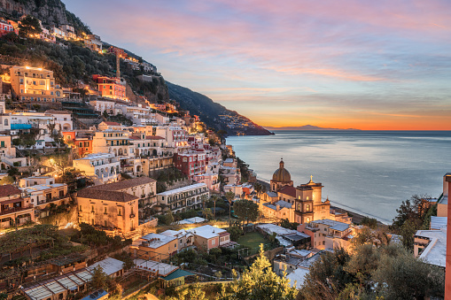 Positano, Italy along the Amalfi Coast at dusk.