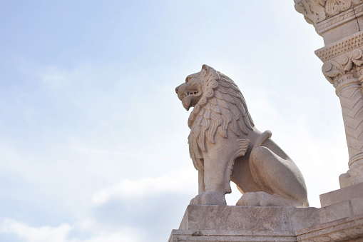 a large stone lion. Fishermen's Bastion is a tourist center. Hungary. Budapest