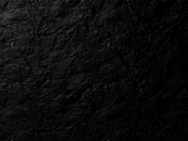 istock The background image of a completely black rock with lights shining down from above. 3D scene. 1421062268