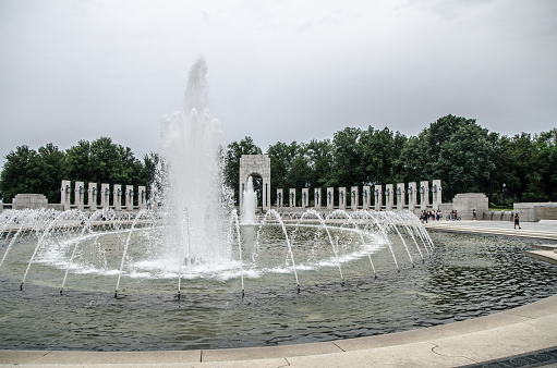 Fountain at World War II memorial in Washington DC during summer day