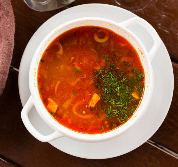 istock Russian cuisine - solyanka soup with various ingredients 1421064683
