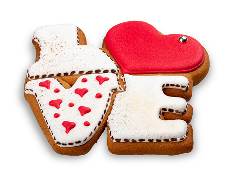 Gingerbread in the shape of LOVE. Isolated on white background