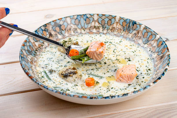 Creamy soup with salmon and vegetables.