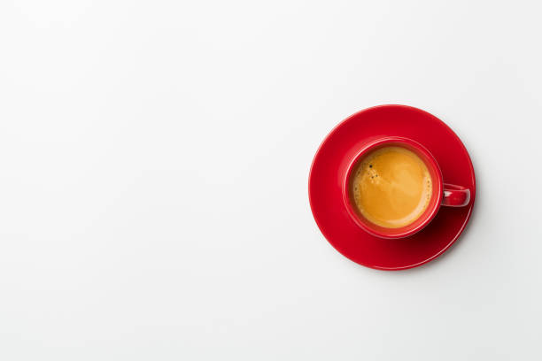 istock Cup of delicious coffee on color background, top view 1421067564