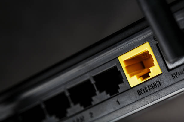istock Yellow Internet connector for connection to the network, Wi-Fi router for Internet access 1421067712