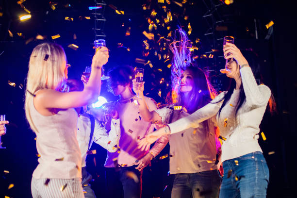 istock Friends celebrating with champagne 1421069160
