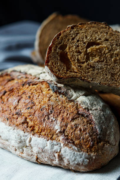 istock Freshly baked bread with a golden crust close up. 1421069342