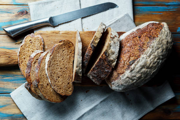 istock Freshly baked bread with a golden crust close up. 1421069443
