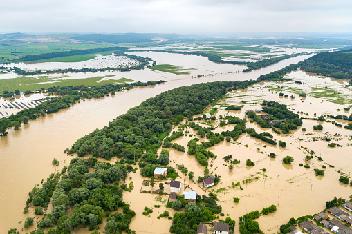 Aerial view of Dnister river with dirty water and flooded houses in Halych town, western Ukraine.