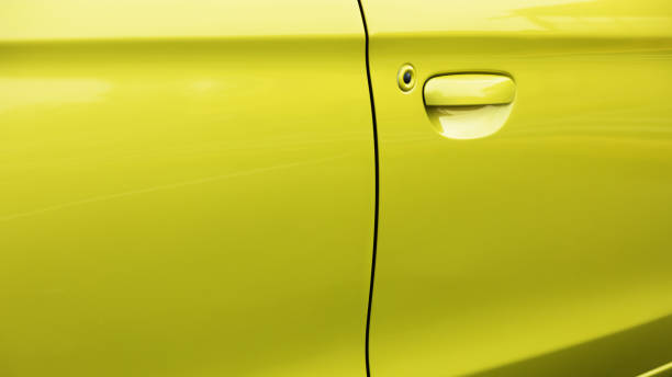 istock Detail and doors of lime colored car 1421075049