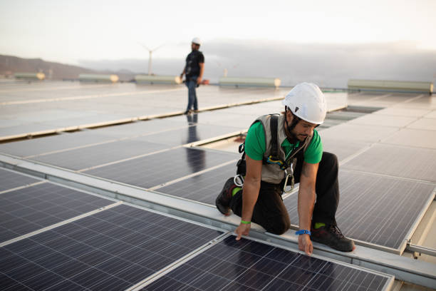 istock Installing solar panels on a roof top 1421080030
