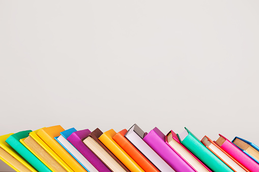 Colored books on light background. Education. School