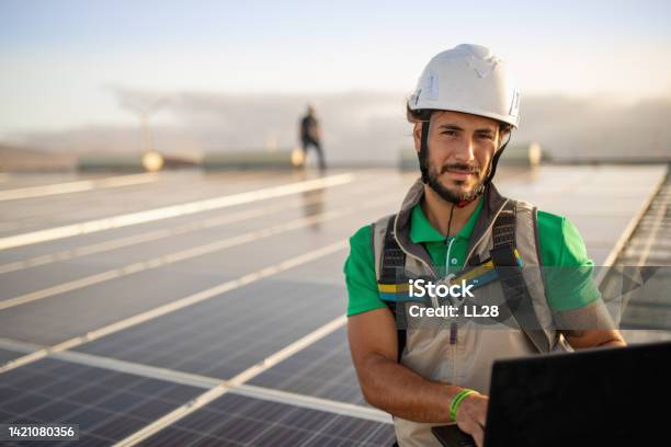 Checking Productivity At Solar Power Plant With Laptop Stock Photo - Download Image Now