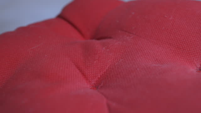 Dirty office chair pillow before cleaning. Close-up video.