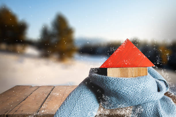 istock house model with scarf on snow background 1421090750