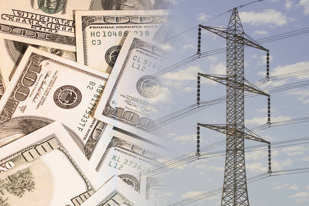 istock American dollars banknotes on electric pole background. Increasing consumption, energy crisis. Inflation. Price energy are getting more expensive annually 1421091073