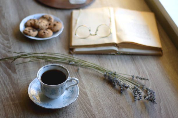 istock Tea, Cookies, Book, Candles and Lavender 1421091902