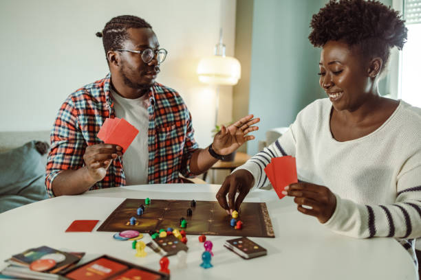 istock Game night at home and having fun with board games 1421092411