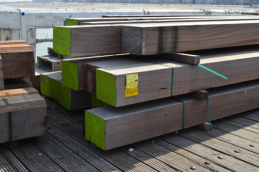 Blankenberge, West-Flanders Belgium - September 04, 2022: Azobé, construction wood, Forest Stewardship Council controlled wood stapled to renew the columns supporting the pier in the sea water
