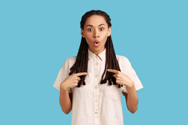 istock Woman pointing at herself, asks who me, has surprised expression, shocked being picked. 1421095758