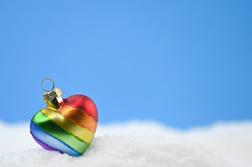 Rainbow heart ornament in the snow