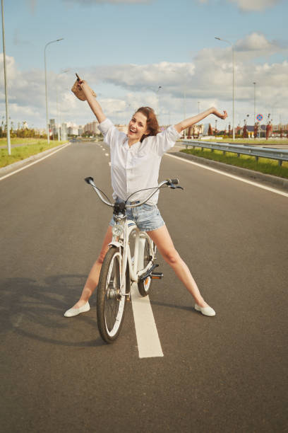 istock happy girl biker 1421097184