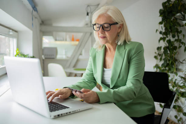 istock Woman using her card shop online 1421099311