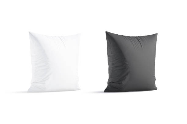 istock Blank white and black square pillow mockup stand, half-turned view 1421099956