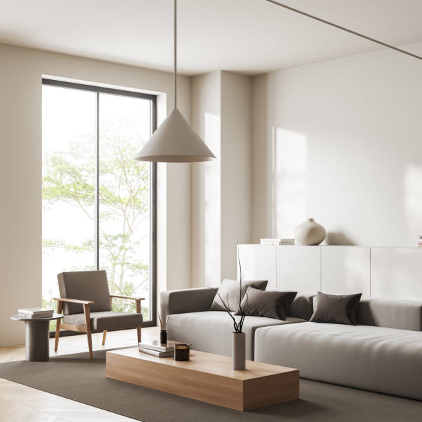 istock Light chill room interior with couch, chair and drawer, panoramic window 1421101961