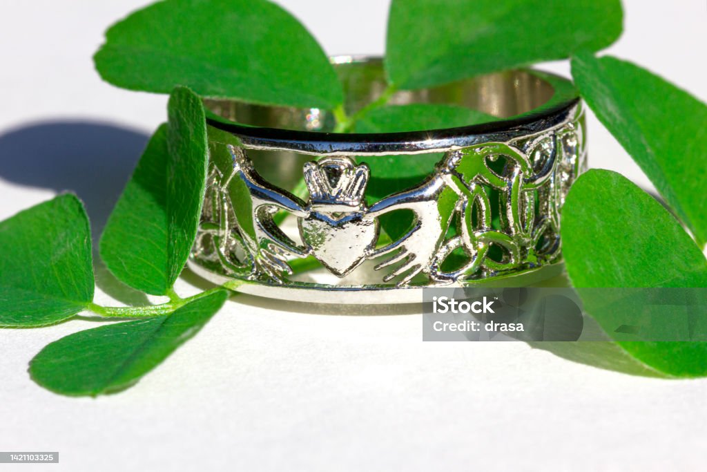 Claddagh ring. Traditional Irish ring in shape of two hands holding a heart shaped. Claddagh ring. Symbol of love, loyalty and friendship. Backgrounds Stock Photo
