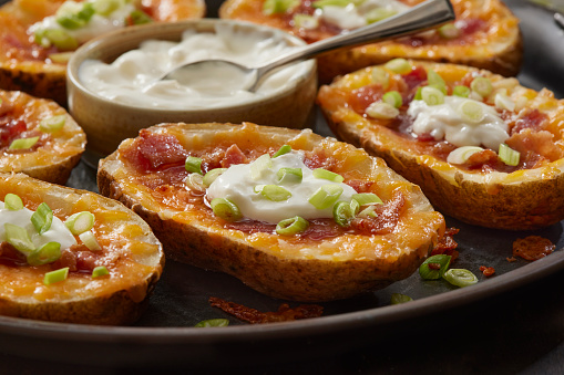 Loaded Potato Skins with Cheddar Cheese, Bacon, Green Onions and Sour Cream
