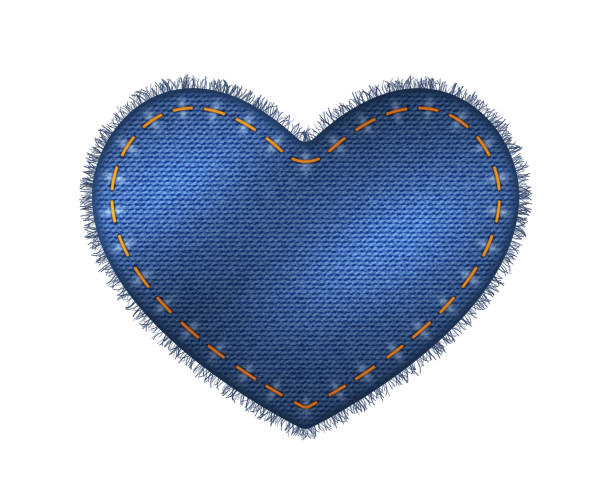 istock Heart shape patch of blue jeans denim texture. Realistic sturdy cotton twill fabric of jeans label 1421108637