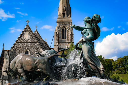 The Gefion fountain at St Albans church in Copenhagen.  The statue was designed by  Anders Bundgaar, who sculpted the figures between 1897 en 1899. The fountain itself was first activated in 1908.