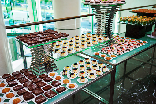 sweet treats and cakes at a festive banquet in a restaurant from a pastry chef