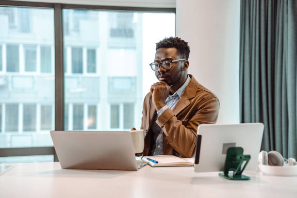 istock Serious businessmen is looking at data on the laptop screen 1421116604