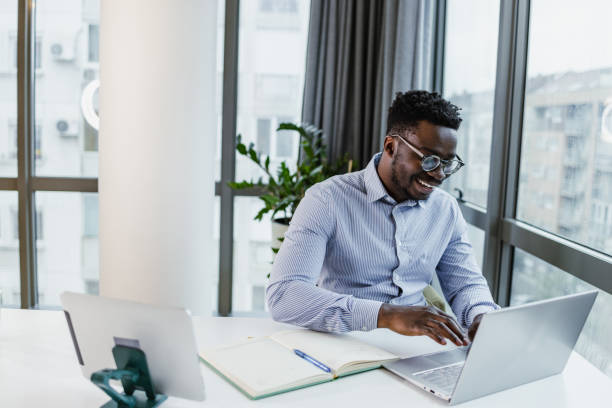 istock Young businessman working at his office 1421116870