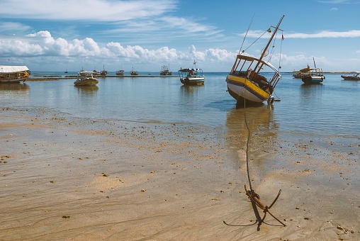 A Lobster boat with traps heading out to check his traps.