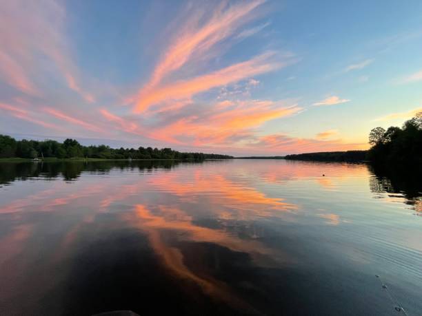 istock Pink cloud burst over the lake 1421118482
