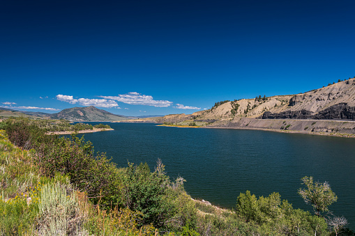 The Green Mountain Reservoir is fed by the Blue River from the south and drains into the same river in the north.  The Blue River joins the Colorado River a few miles north of the reservoir.  The reservoir provides recreational opportunities for boating and fishing as well as a natural habitat for wildlife.